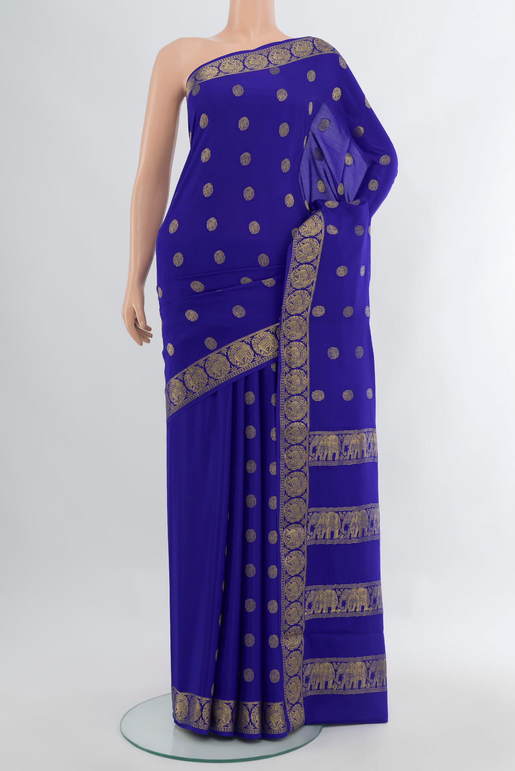 Royal Blue Mysore Crepe Saree with Zari Butta on the body and Zari Border.  displayed on a mannequin