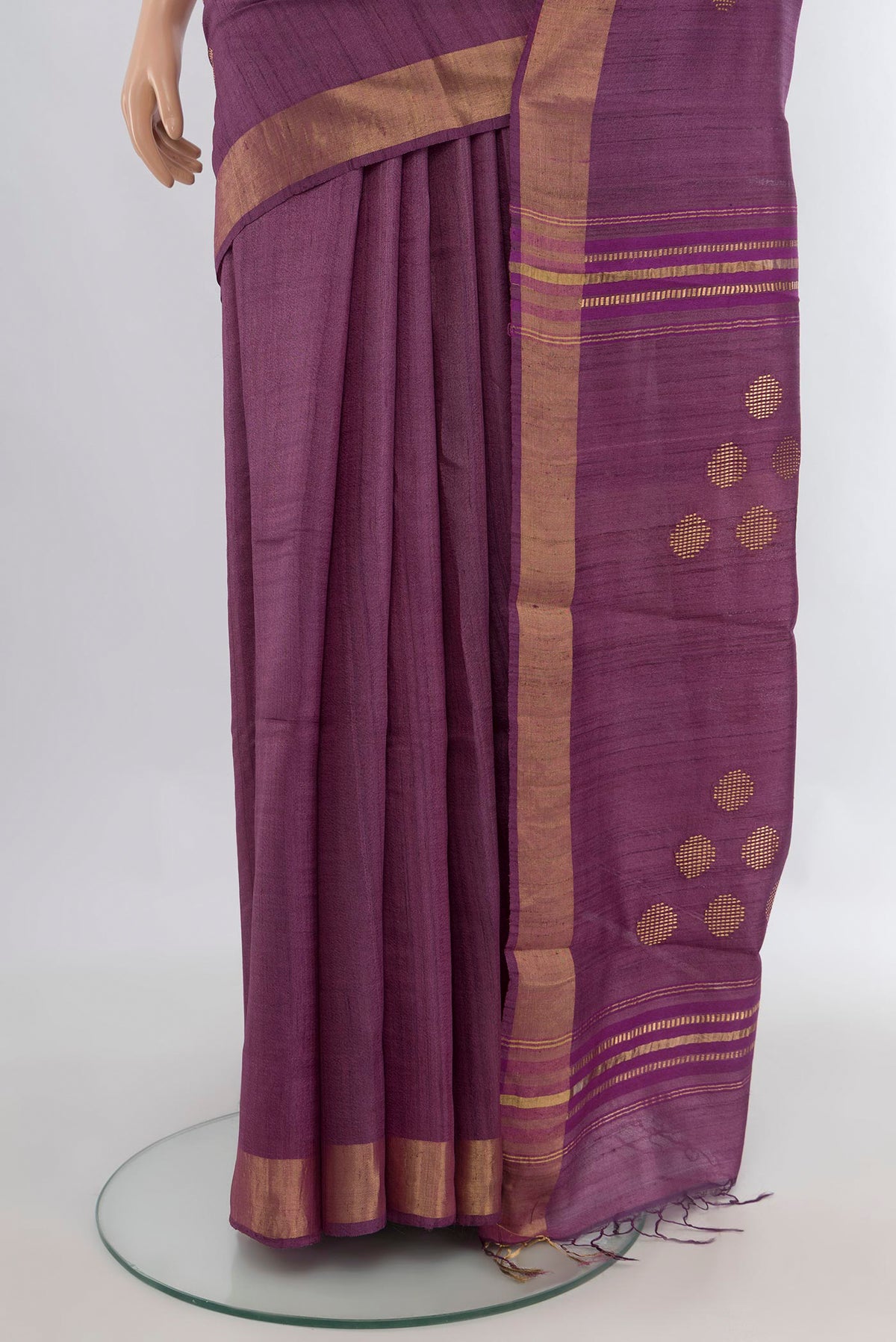 Pleats and pallu of Pure Silk Mauve Tussar Saree with Thread Butta on the body and Zari Border. 