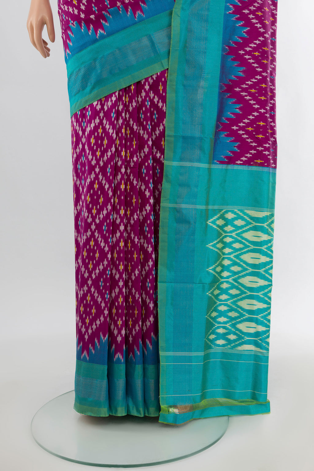 Pleats and pallu of Magenta Pochampally Silk Saree with Ikat design on the body and Zari Border. 