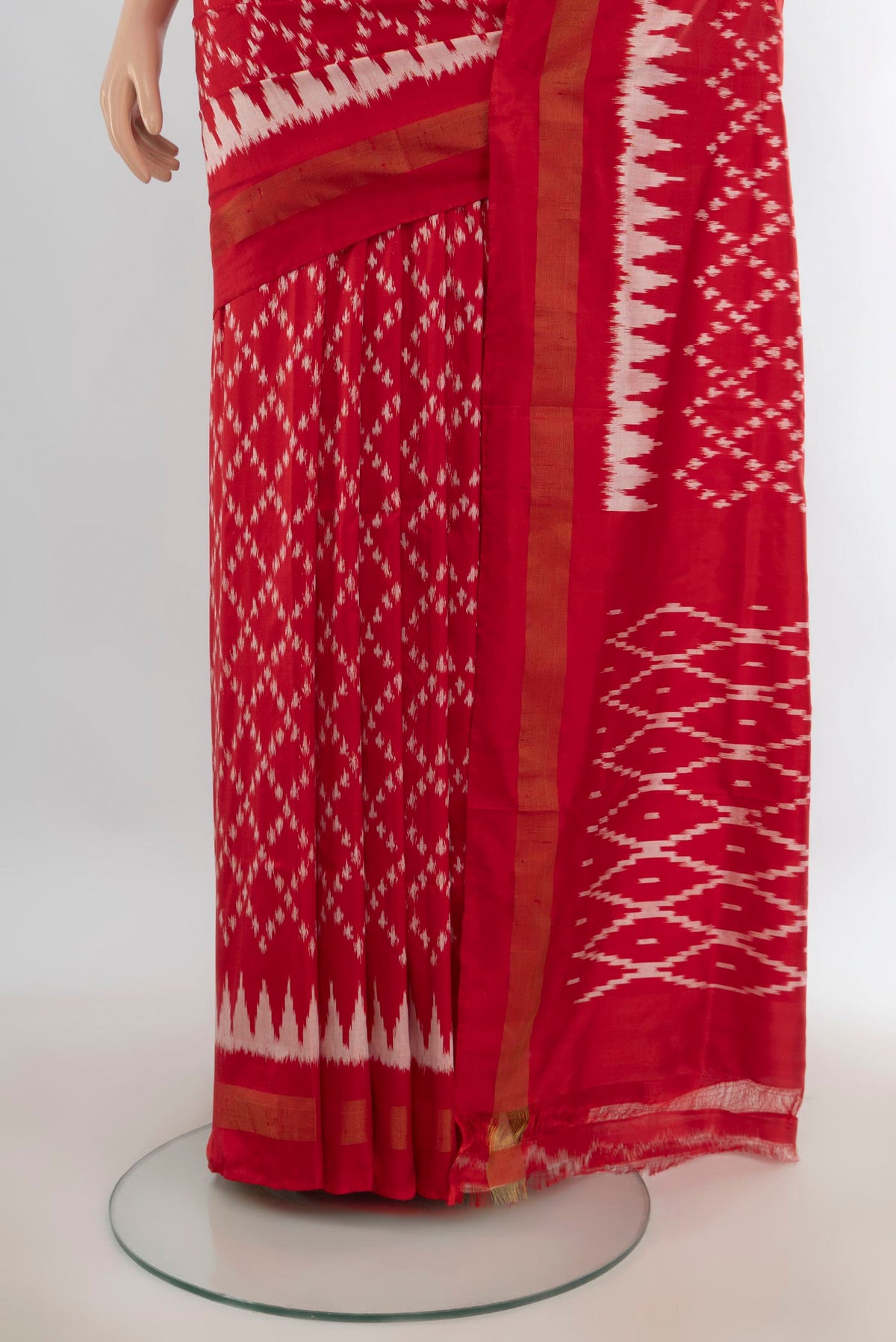Pleats and pallu of Pure Silk Red Pochampally Saree with Pure Ikat on the body and Zari Border. 