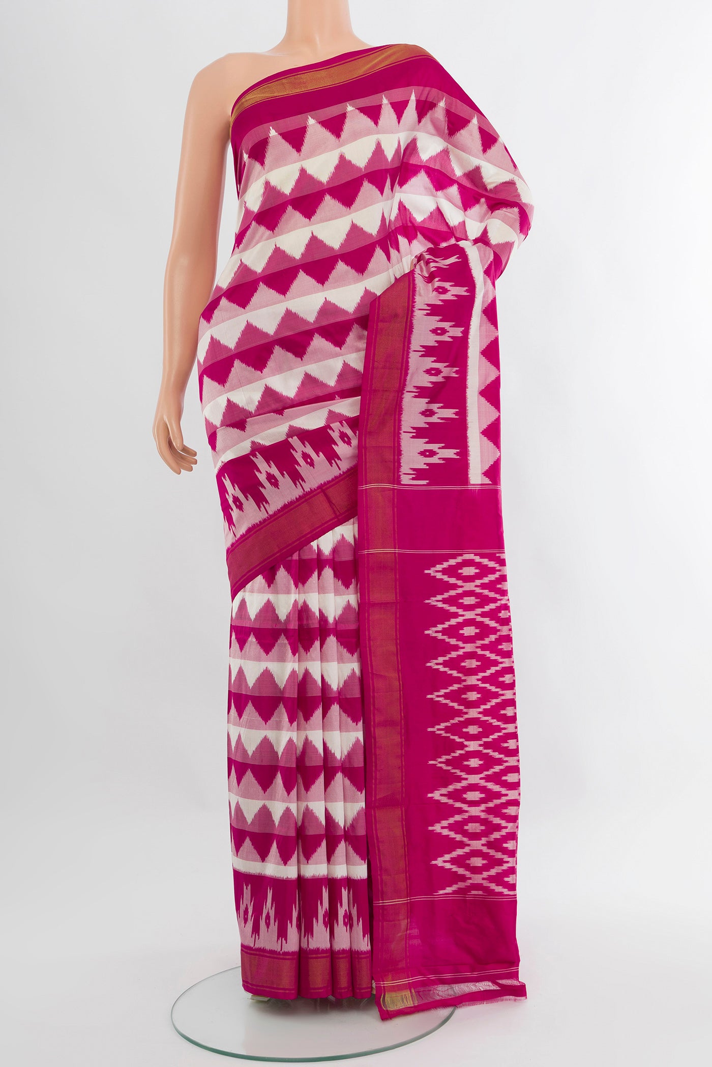 Pink Pochampally Silk Saree with Ikat design on the body and Zari Border.  displayed on a mannequin