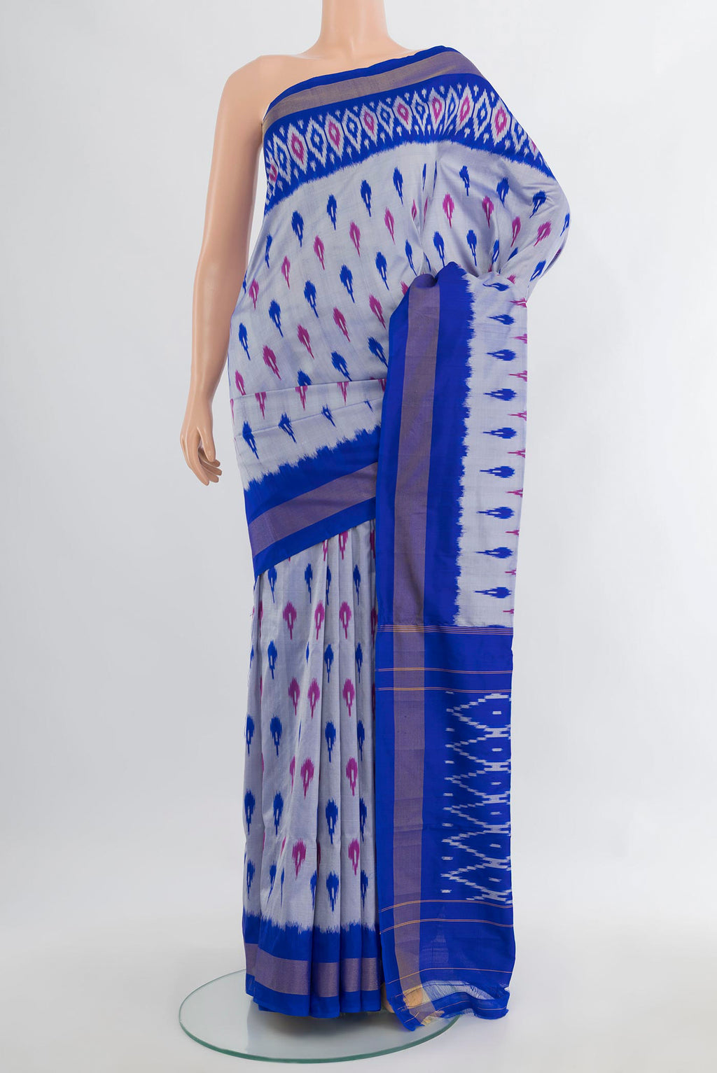 Pure Silk Grey Pochampally Saree with Ikat Print on the body and Ikat Border.  displayed on a mannequin