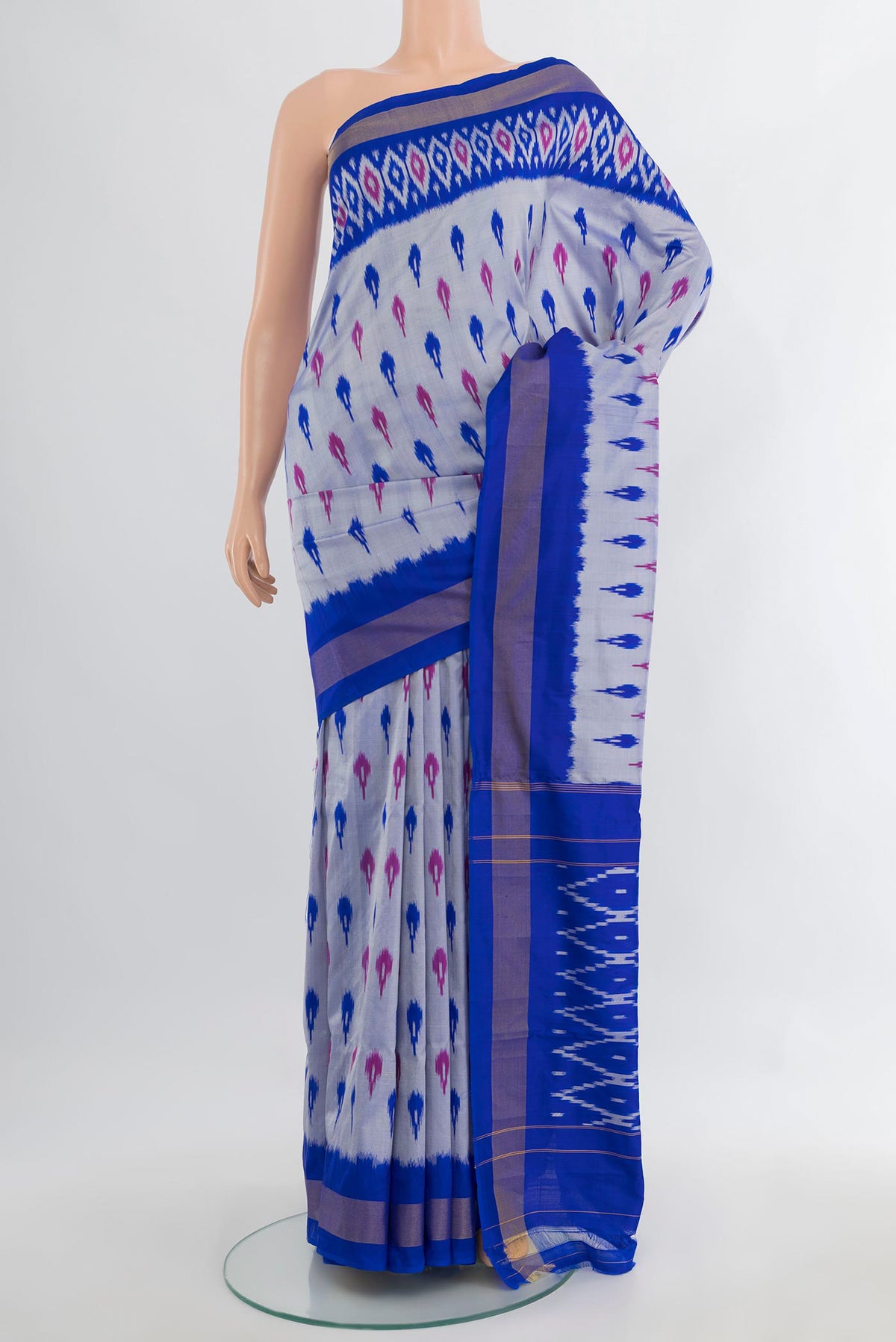 Pure Silk Grey Pochampally Saree with Ikat Print on the body and Ikat Border.  displayed on a mannequin