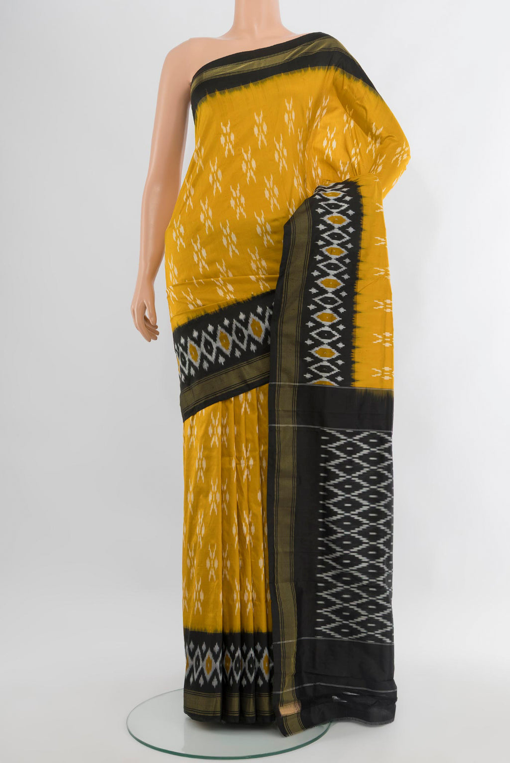 Yellow Pochampally Silk Saree with Pure Ikat on the body and Ikat Border.  displayed on a mannequin