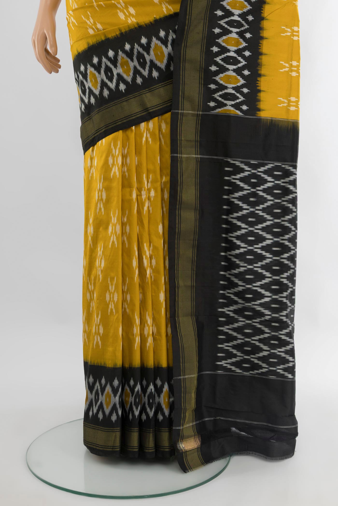 Pleats and pallu of Yellow Pochampally Silk Saree with Pure Ikat on the body and Ikat Border. 