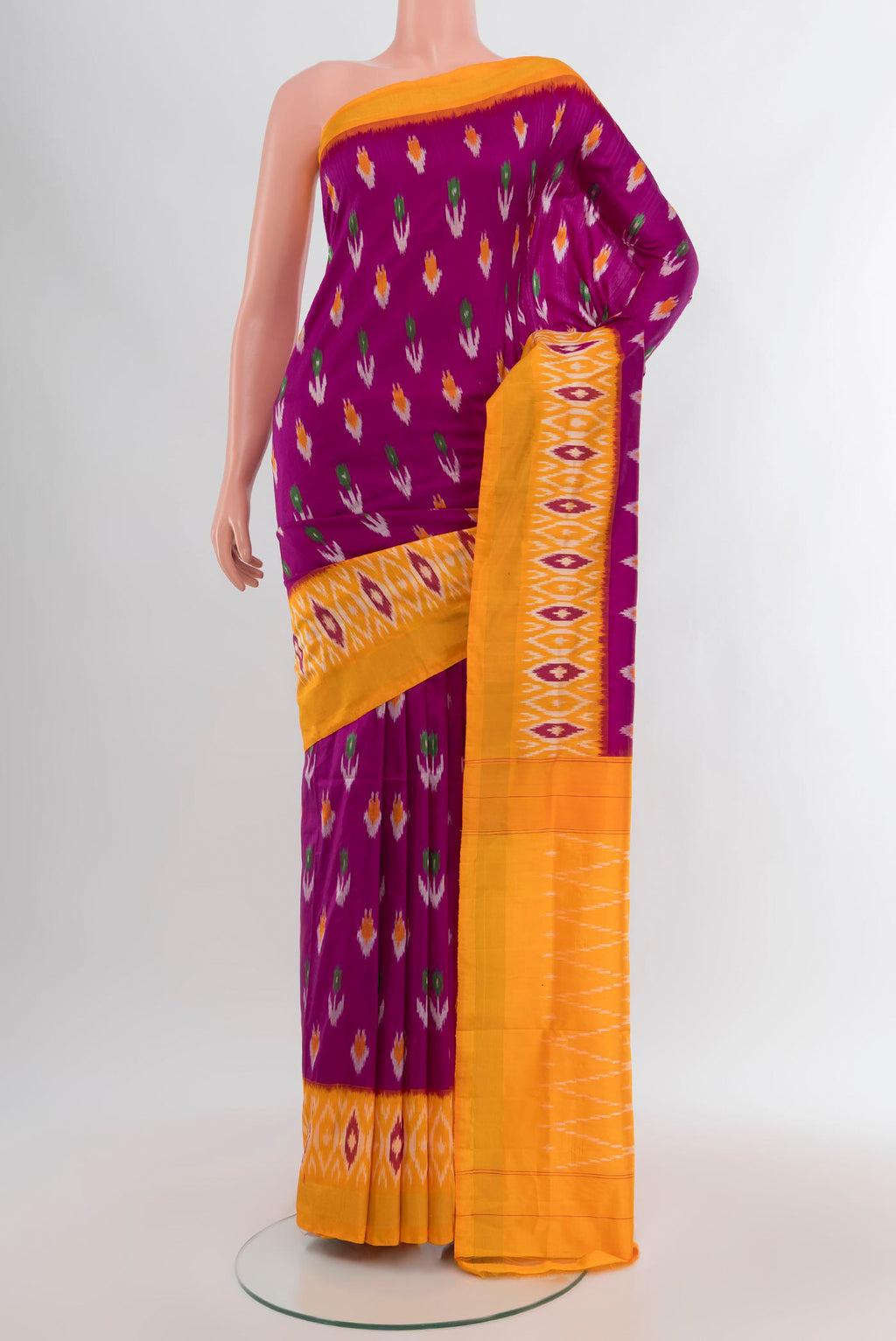 Purple Pochampally Silk Saree with Pure Ikat on the body and Ikat Border.  displayed on a mannequin