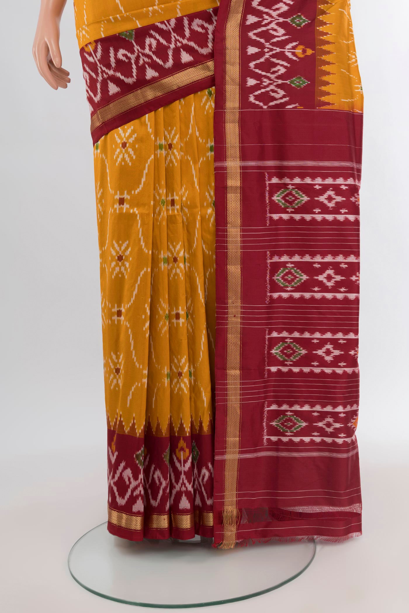 Pleats and pallu of Mustard Pochampally Silk Saree with Pure Ikat on the body and Ikat Border. 