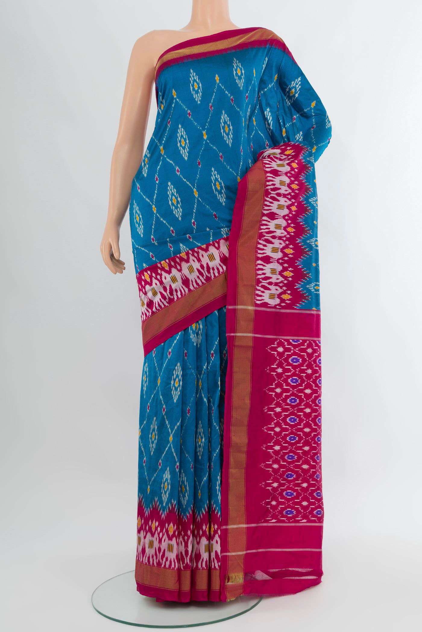 Blue Pochampally Silk Saree with Pure Ikat on the body and Zari Border.  displayed on a mannequin
