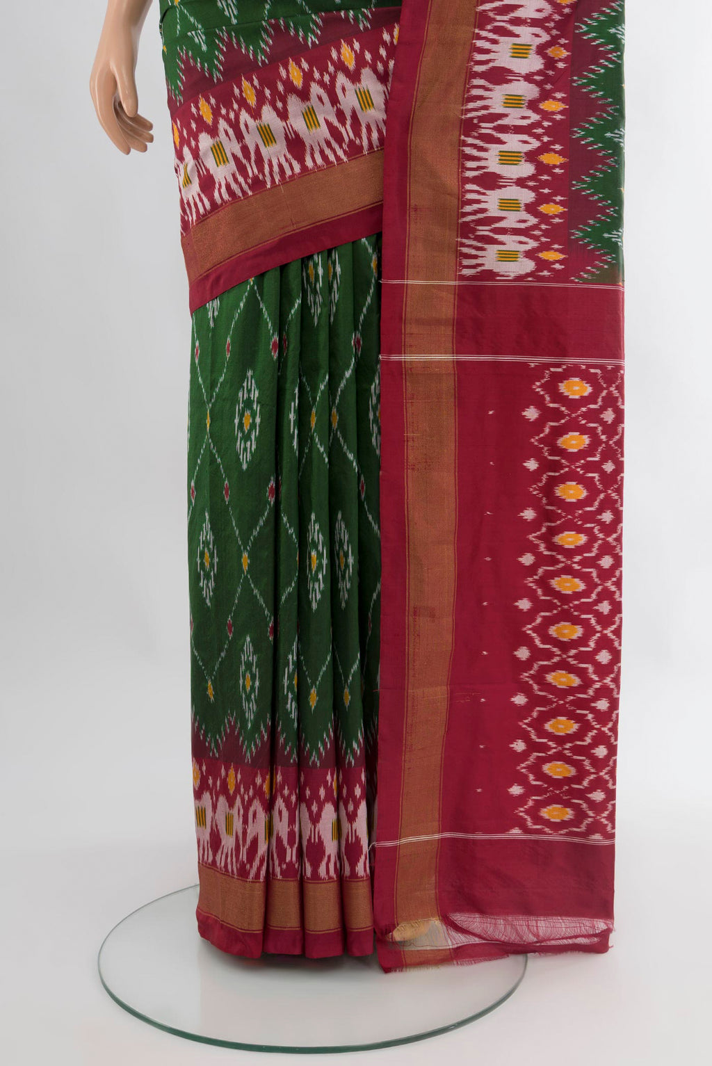Pleats and pallu of Bottle Green Pochampally Silk Saree with Ikat design on the body and Zari Border. 