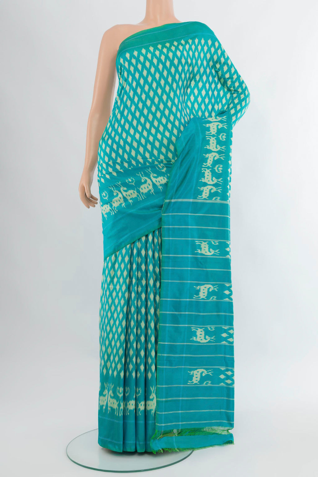 Light Blue Pochampally Silk Saree with Pure Ikat on the body and Plain Border.  displayed on a mannequin
