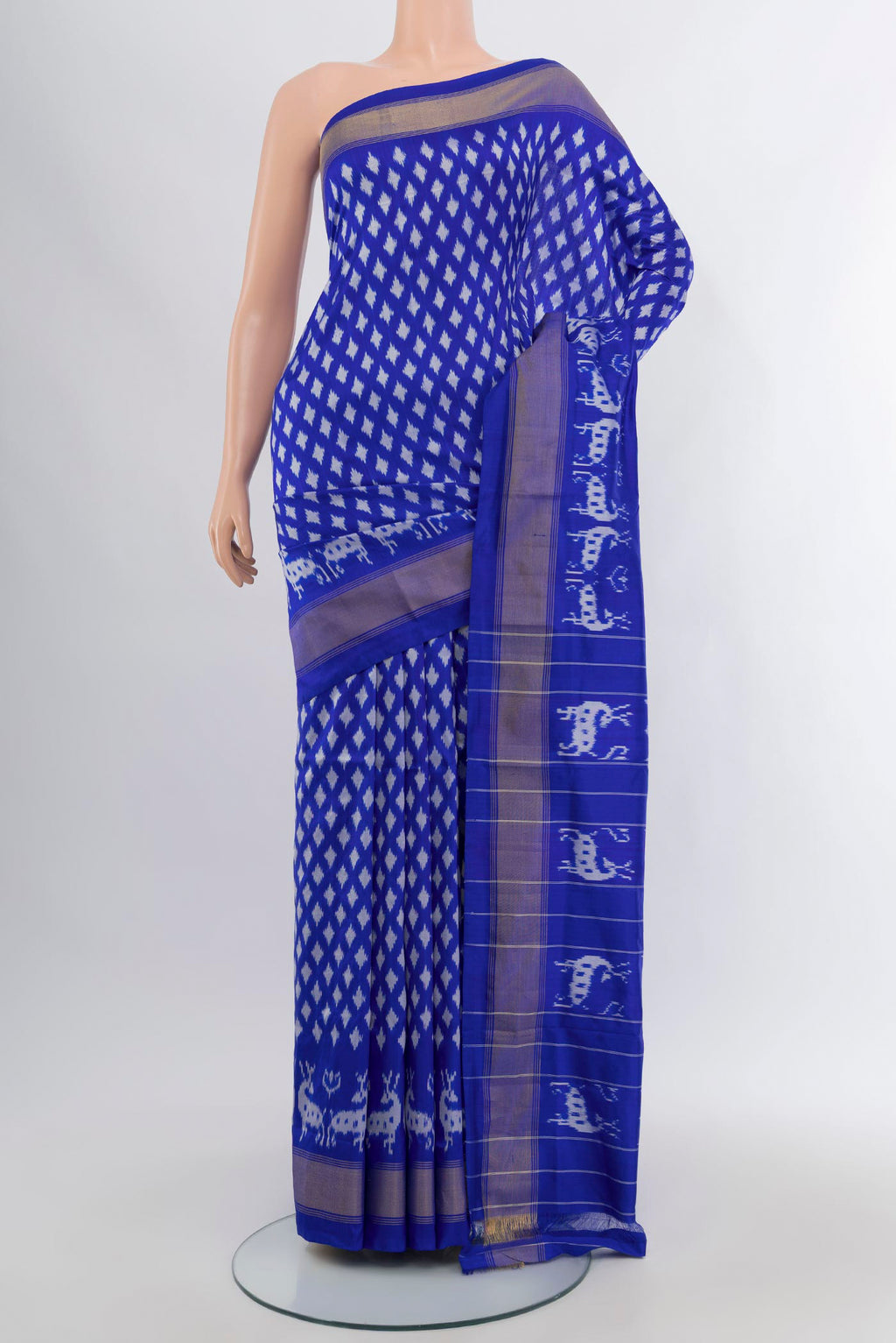 Royal Blue Pochampally Silk Saree with Ikat design on the body and Zari Border.  displayed on a mannequin