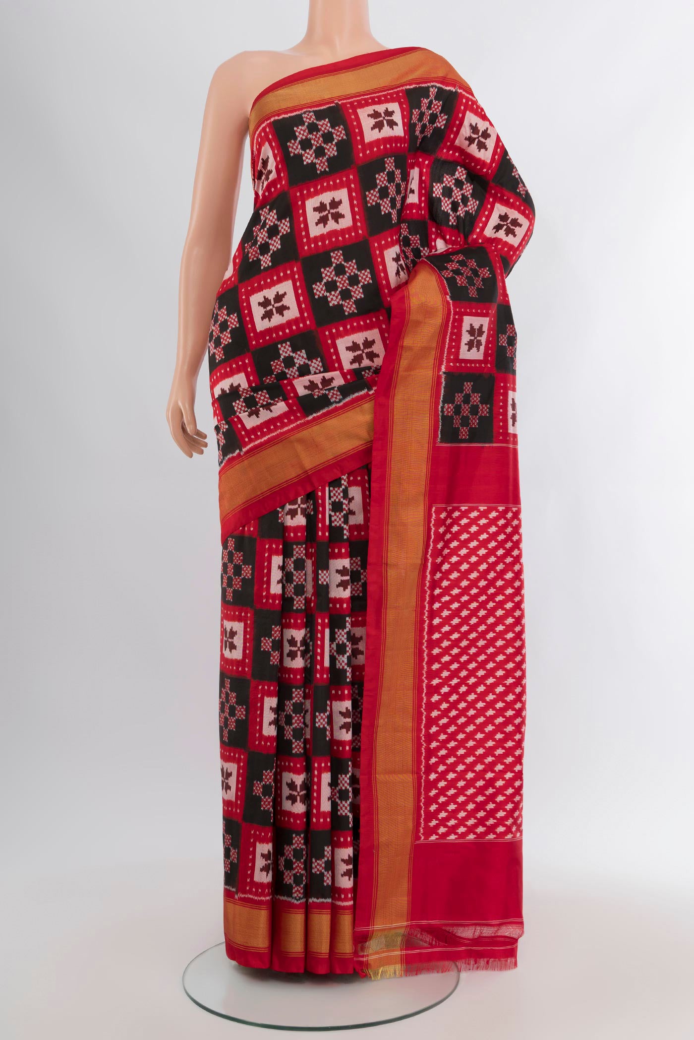 Multi Color Pochampally Silk Saree with Pure Ikat on the body and Zari Border.  displayed on a mannequin
