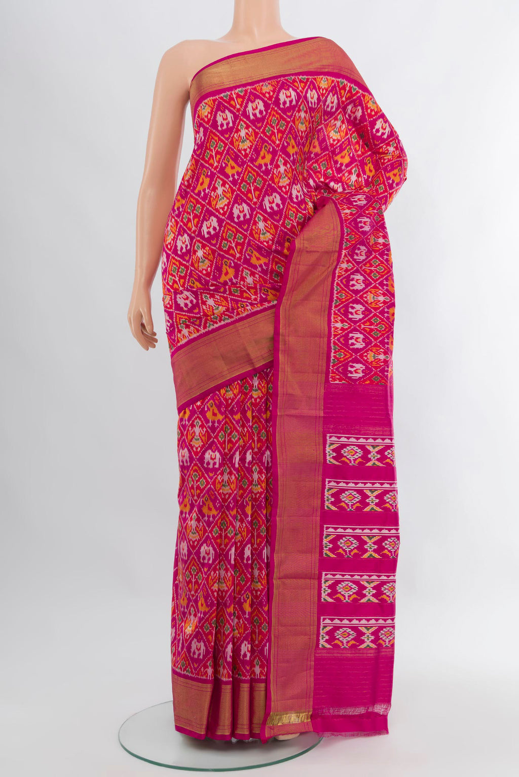 Pink Pochampally Silk Saree with Ikat design on the body and Zari Border.  displayed on a mannequin