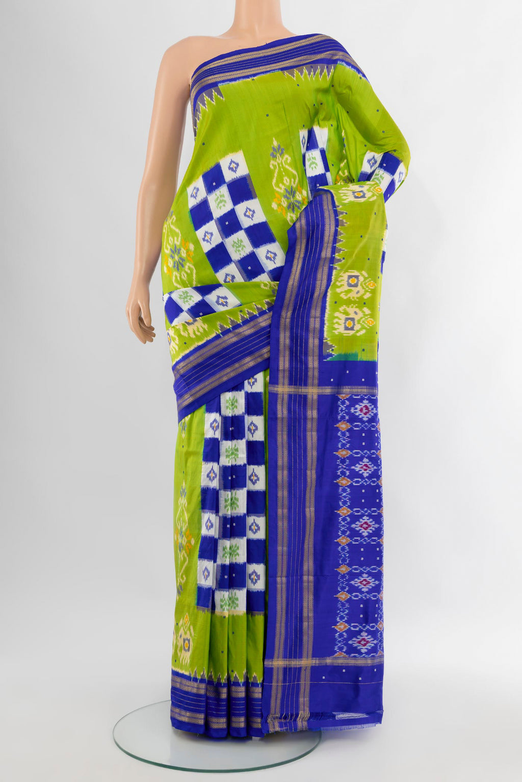 Parrot Green Pochampally Silk Saree with Pure Ikat on the body and Zari Border.  displayed on a mannequin