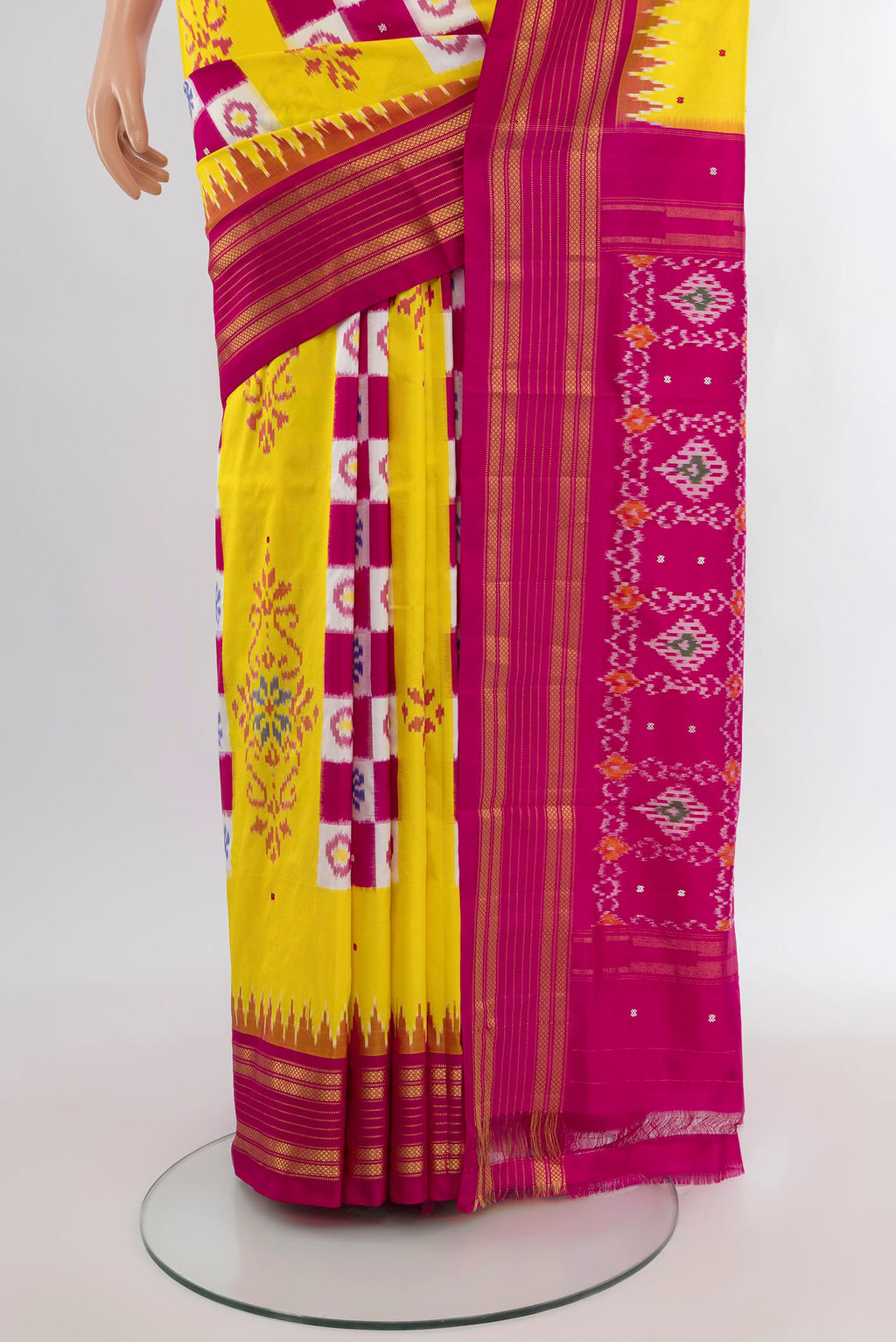 Pleats and pallu of Yellow Pochampally Silk Saree with Pure Ikat on the body and Plain Border. 