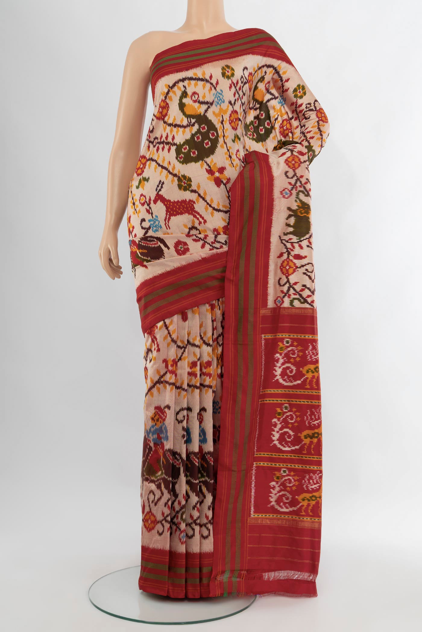 Golden Peach Pochampally Silk Saree with Pure Ikat on the body and Plain Border.  displayed on a mannequin