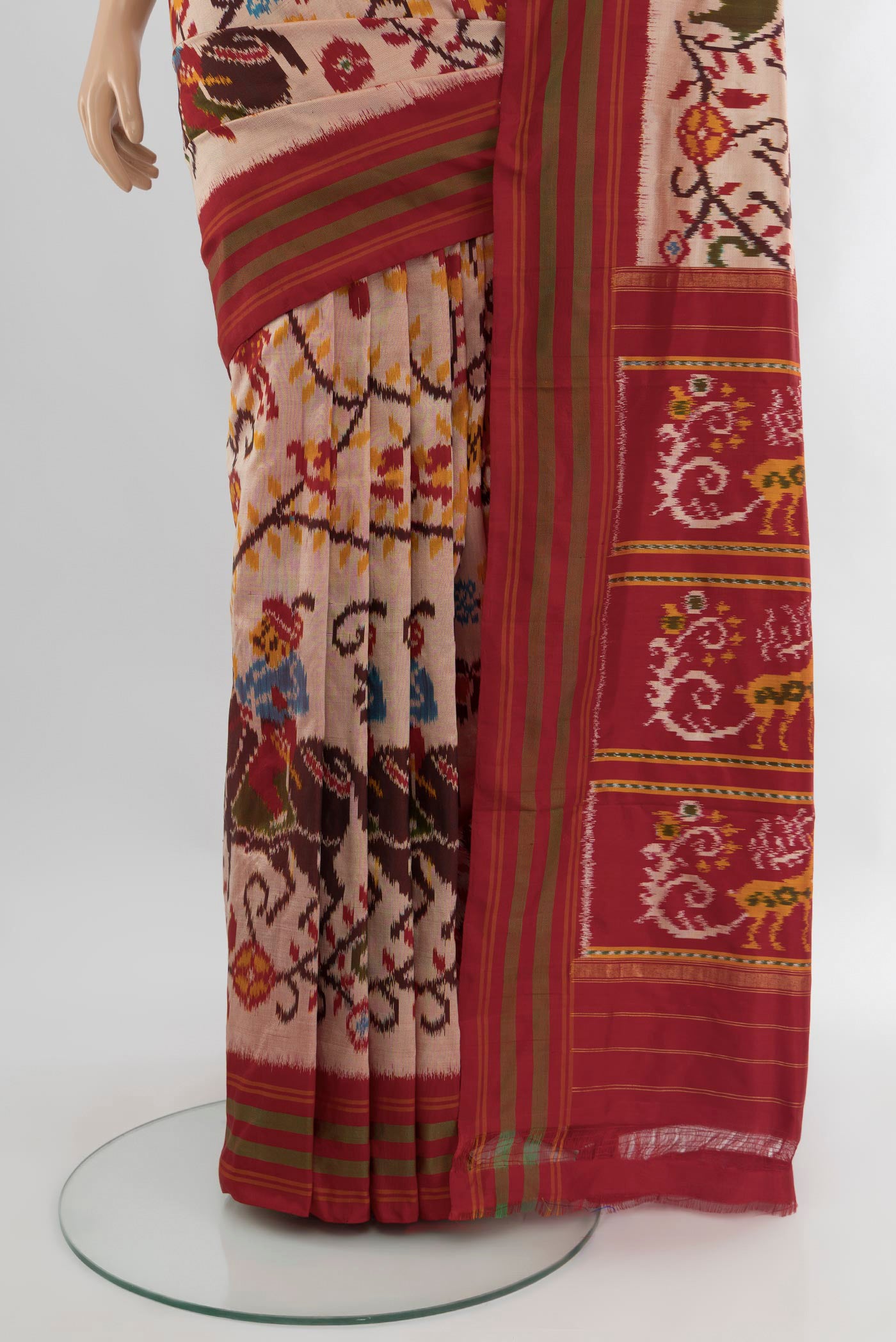 Pleats and pallu of Golden Peach Pochampally Silk Saree with Pure Ikat on the body and Plain Border. 