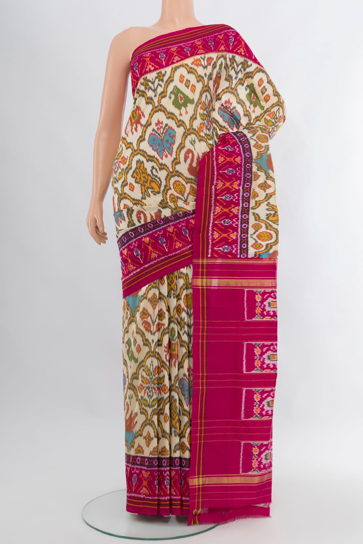 Cream Pochampally Silk Saree with Pure Ikat on the body and Ikat Border.  displayed on a mannequin