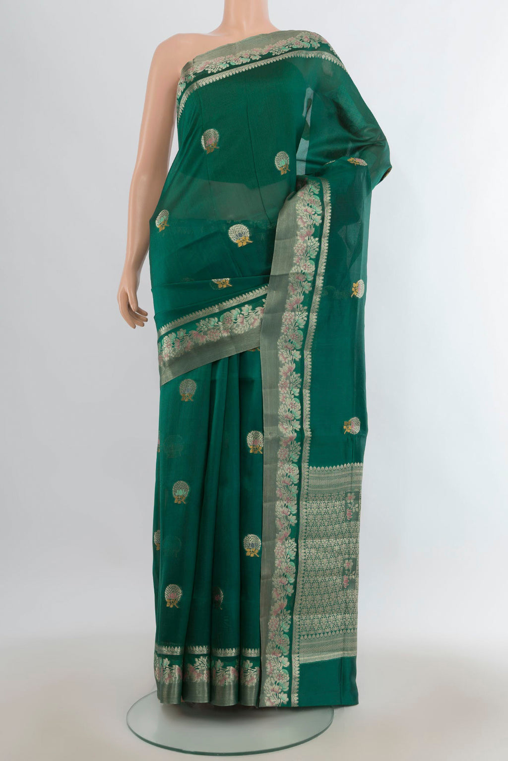 Pure Silk Green Banarasi Raw Saree with Zari Butta on the body and Zari Border.  displayed on a mannequin