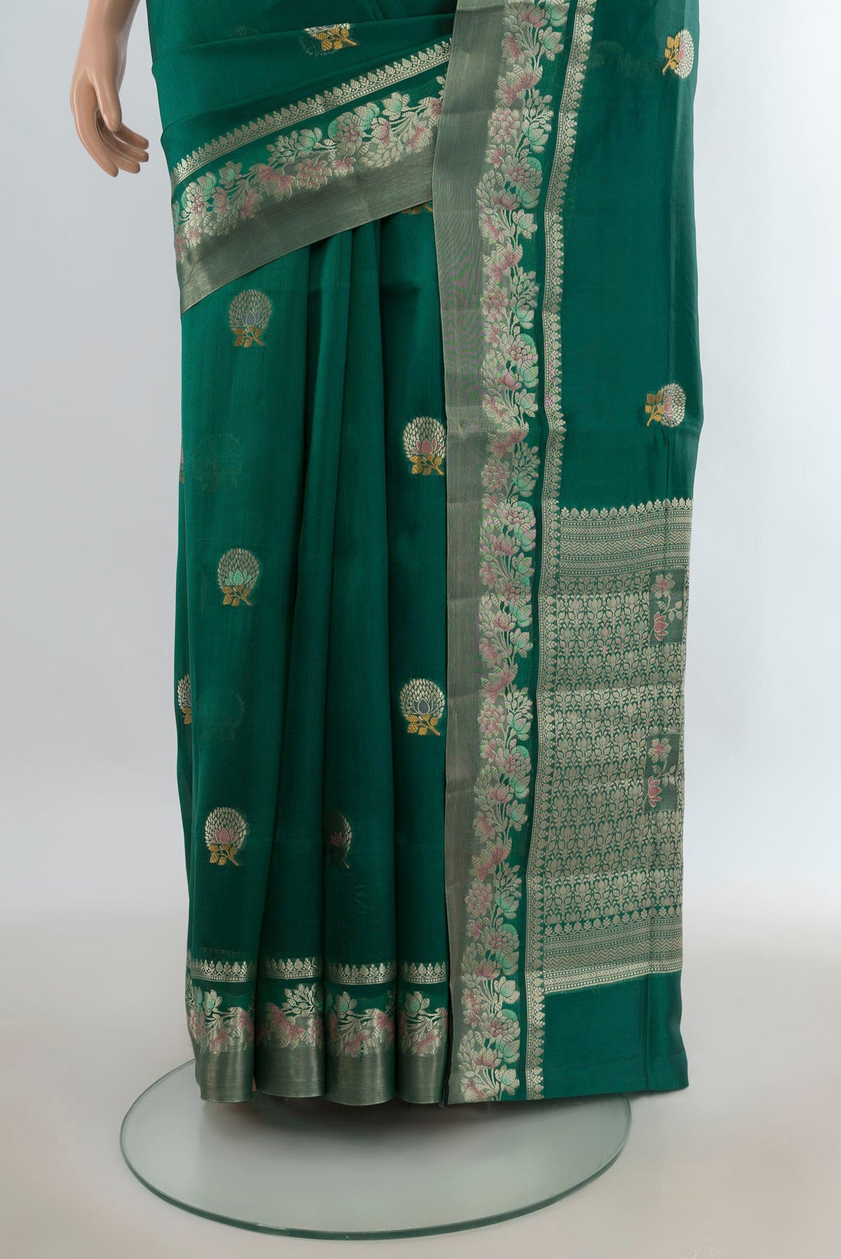 Pleats and pallu of Pure Silk Green Banarasi Raw Saree with Zari Butta on the body and Zari Border. 