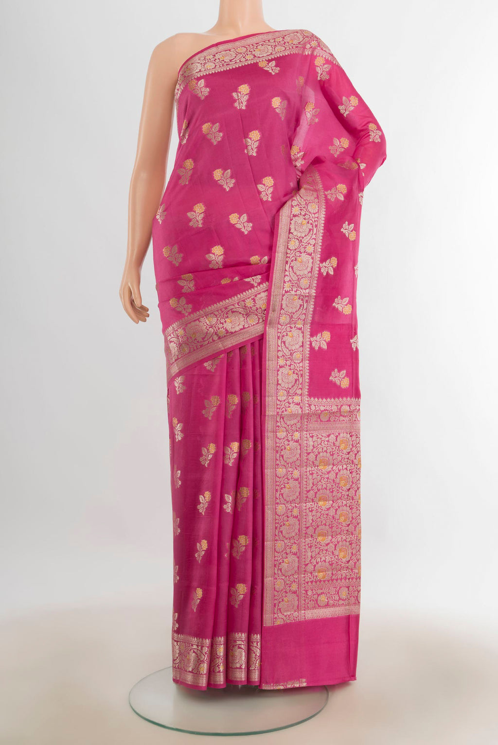 Pure Silk Rose pink Banarasi Raw Saree with Zari Butta on the body and Silk Border.  displayed on a mannequin