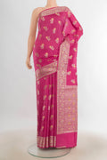 Pure Silk Rose pink Banarasi Raw Saree with Zari Butta on the body and Silk Border.  displayed on a mannequin