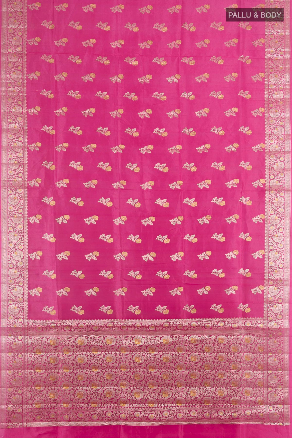 Flat view of Pure Silk Rose pink Banarasi Raw Saree with Zari Butta on the body and Silk Border. 