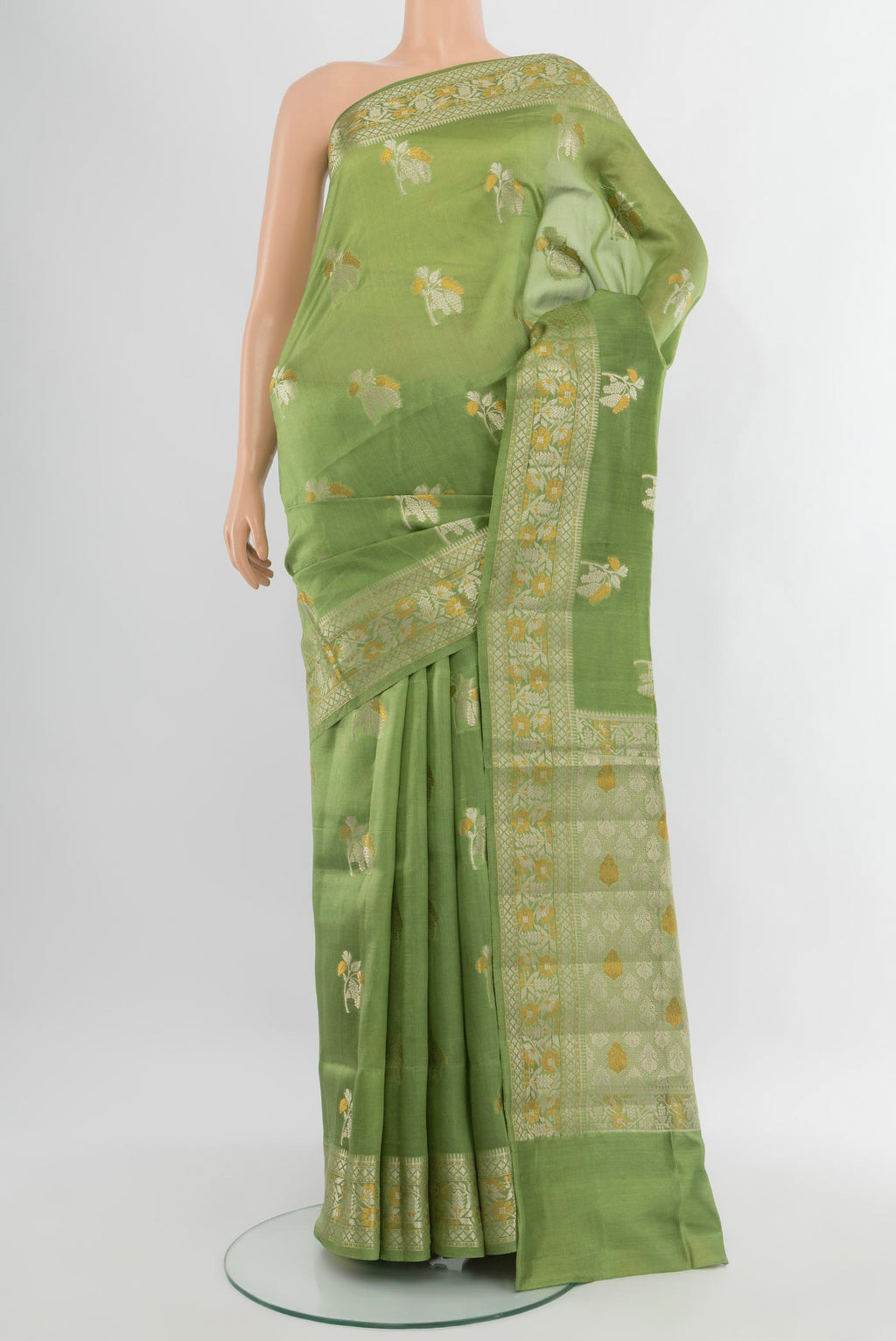 Pista Green Banarasi Raw Silk Saree with Zari Butta on the body and Zari Border.  displayed on a mannequin