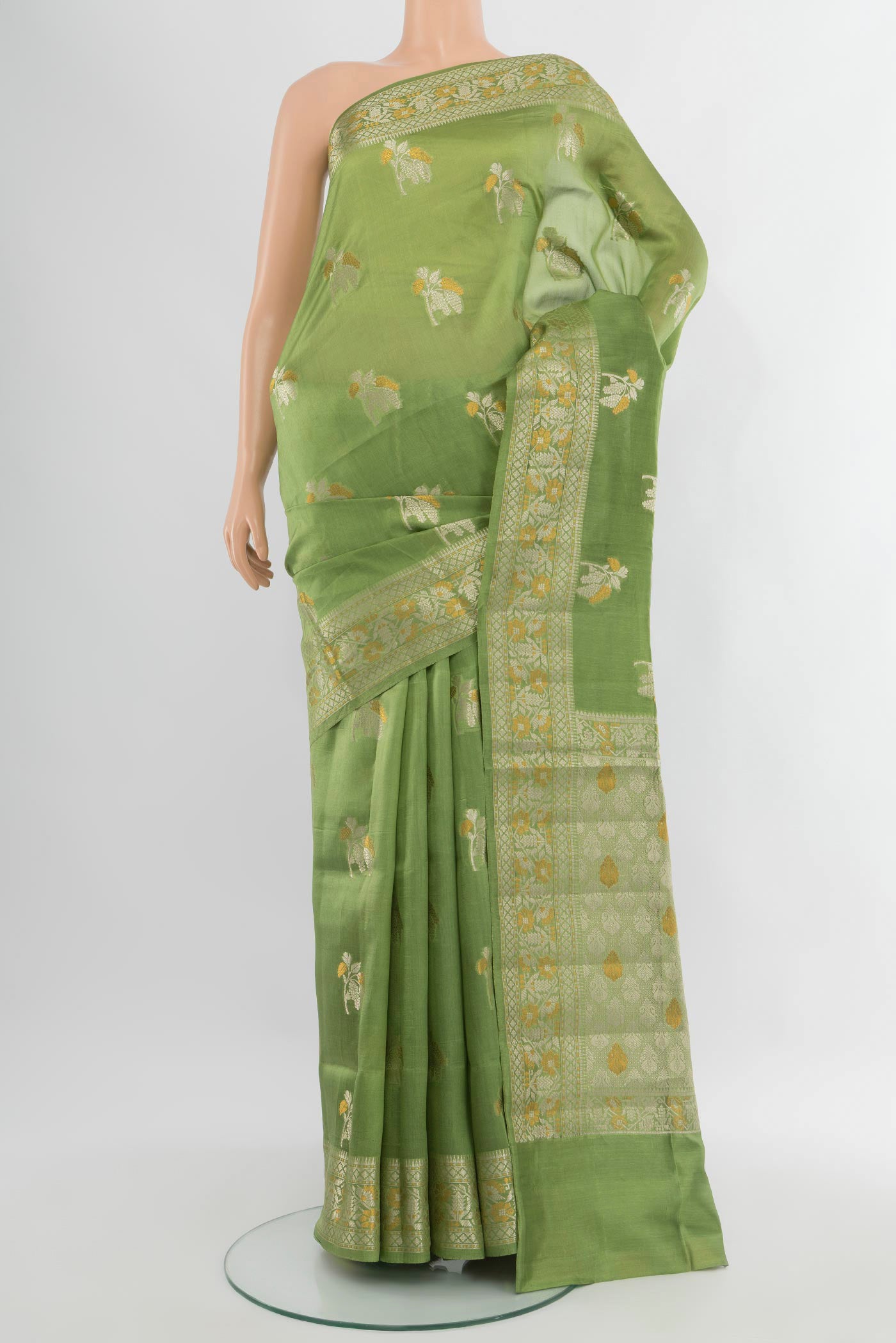 Pista Green Banarasi Raw Silk Saree with Zari Butta on the body and Zari Border.  displayed on a mannequin