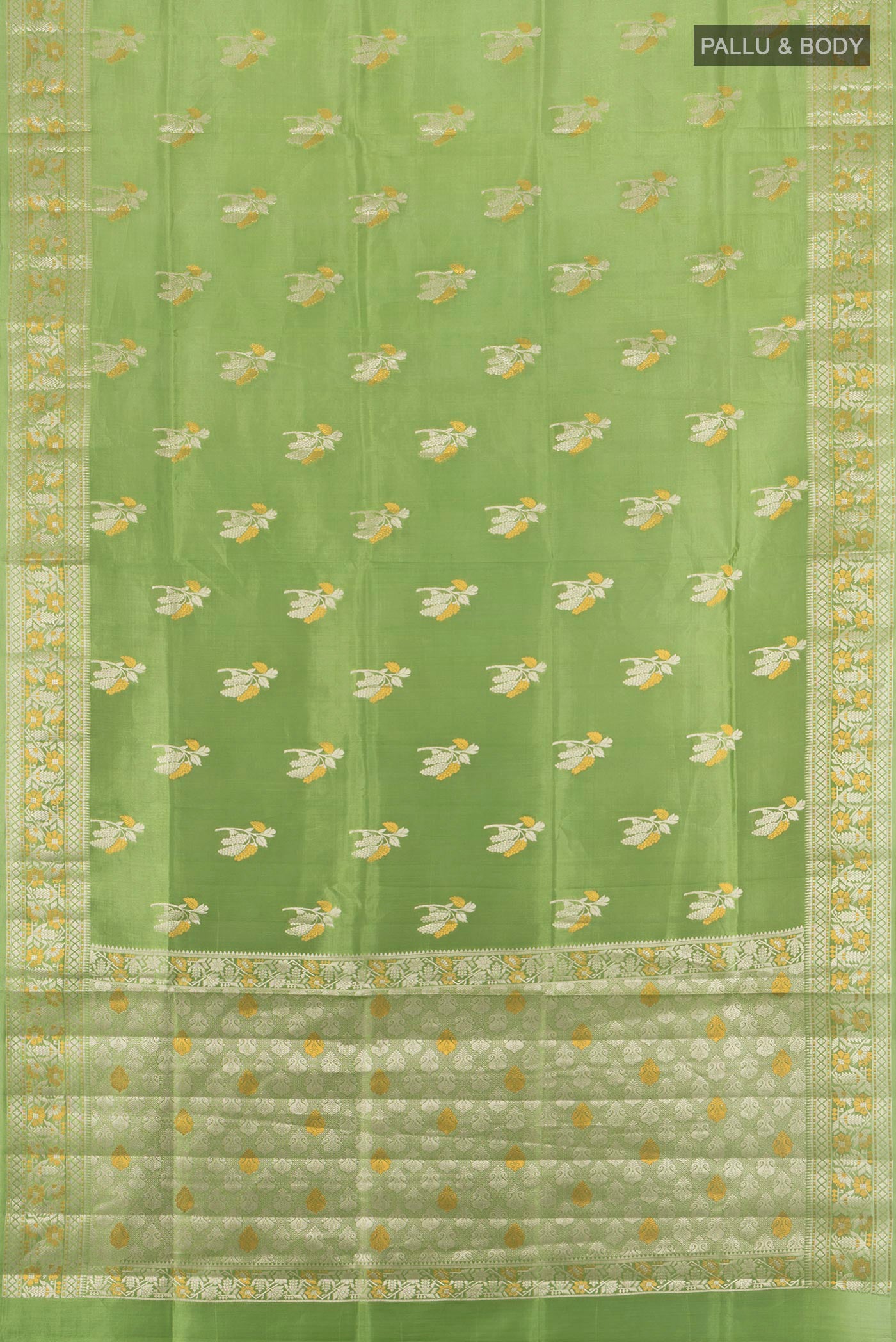 Flat view of Pista Green Banarasi Raw Silk Saree with Zari Butta on the body and Zari Border. 