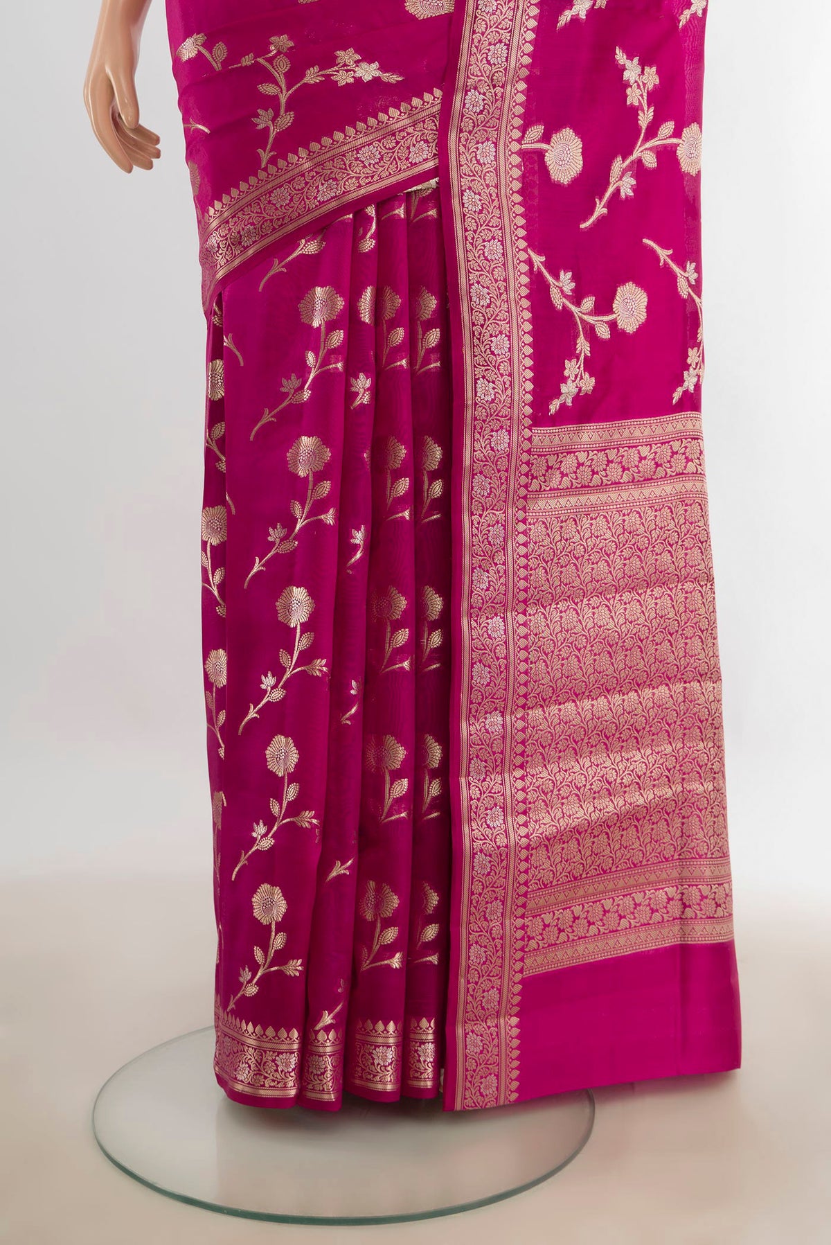 Pleats and pallu of Pure Silk Magenta Banarasi Raw Saree with Zari Butta on the body and Silk Border. 