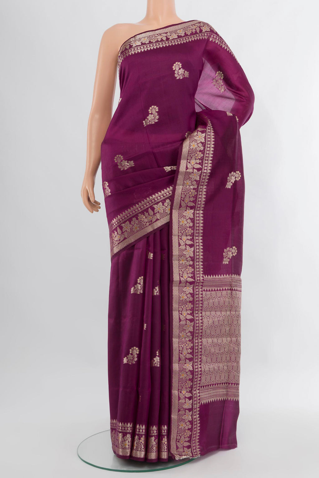 Magenta Banarasi Raw Silk Saree with Zari Butta on the body and Zari Border.  displayed on a mannequin