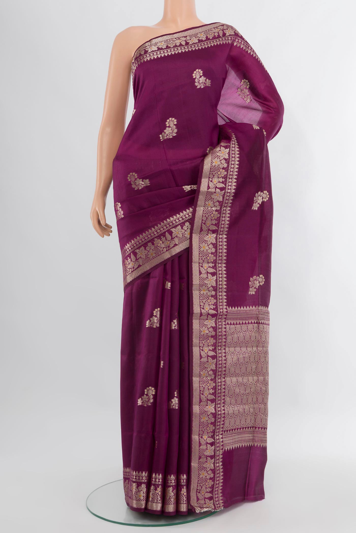 Magenta Banarasi Raw Silk Saree with Zari Butta on the body and Zari Border.  displayed on a mannequin