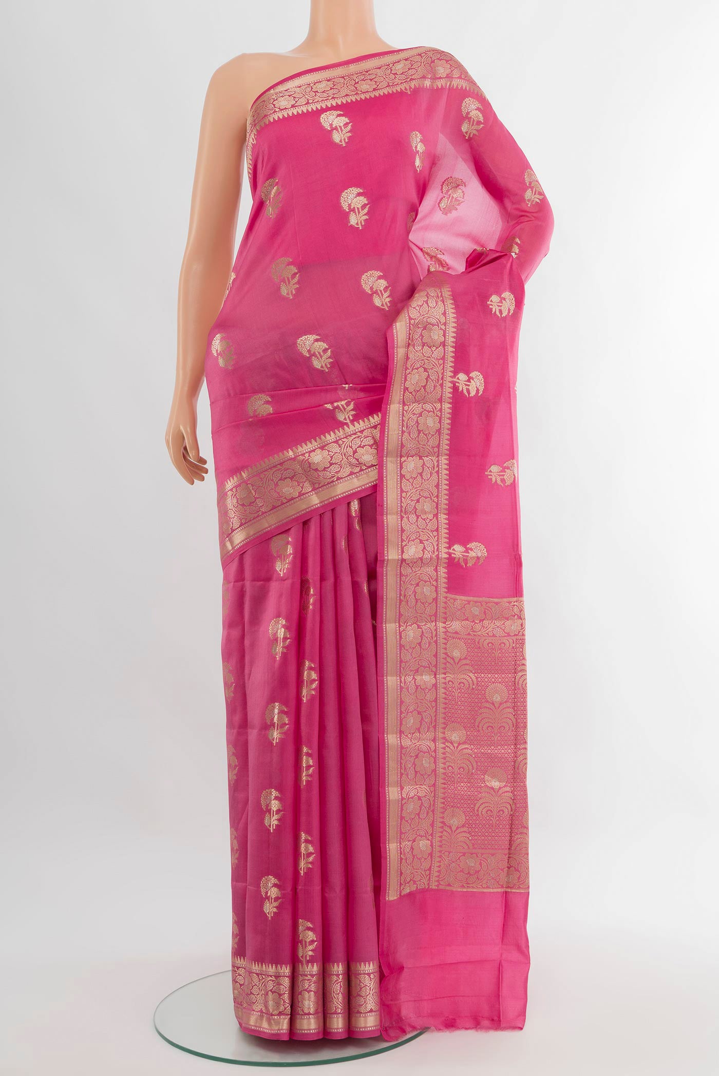 Rose pink Banarasi Raw Silk Saree with Zari Butta on the body and Zari Border.  displayed on a mannequin