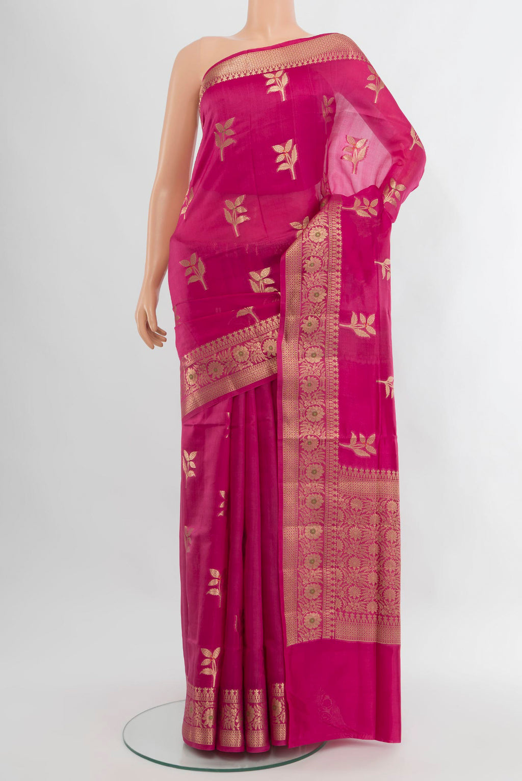 Rani Pink Banarasi Raw Silk Saree with Zari Butta on the body and Zari Border.  displayed on a mannequin