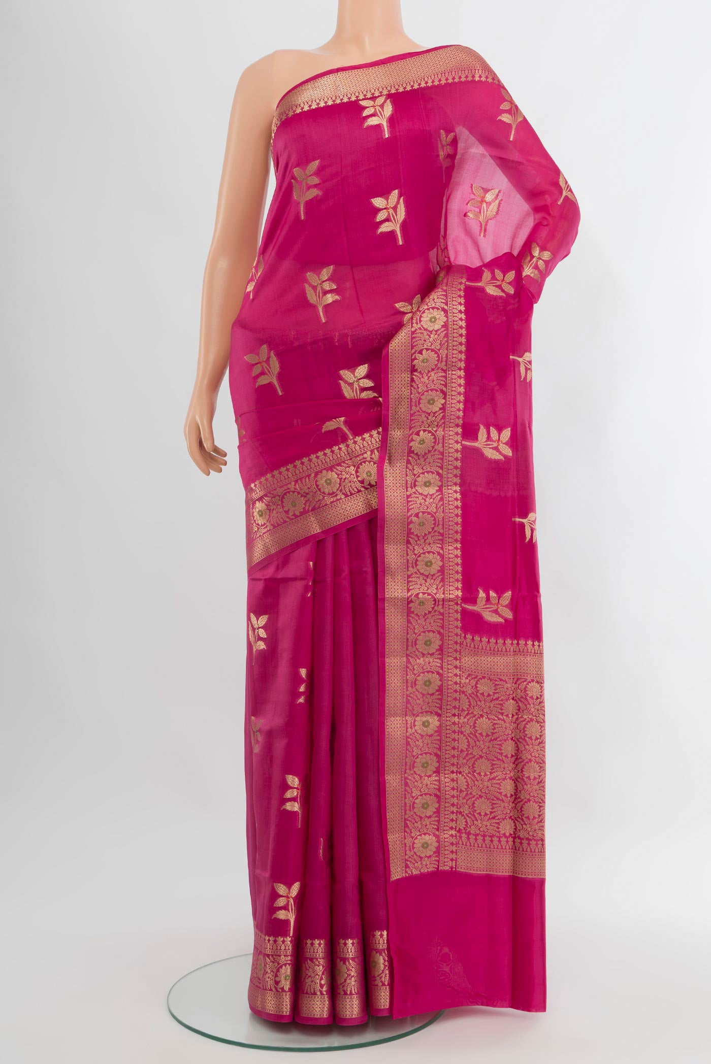 Rani Pink Banarasi Raw Silk Saree with Zari Butta on the body and Zari Border.  displayed on a mannequin