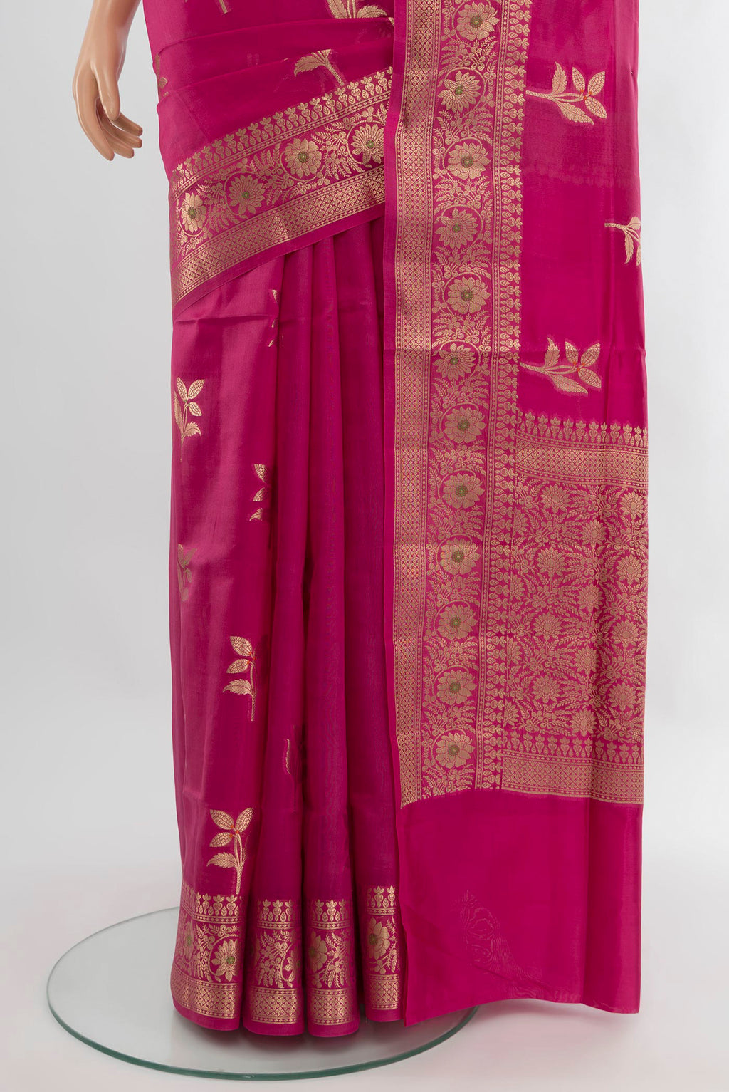 Pleats and pallu of Rani Pink Banarasi Raw Silk Saree with Zari Butta on the body and Zari Border. 