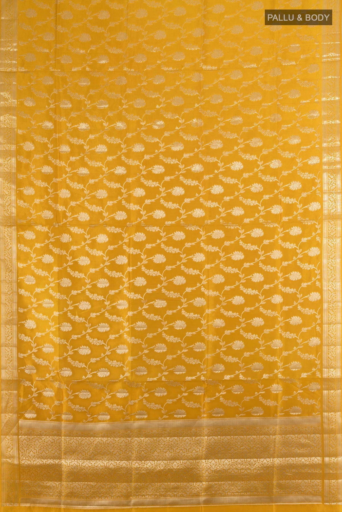 Flat view of Pure Silk Mustard Banarasi Raw Saree with Zari Butta on the body and Silk Border. 