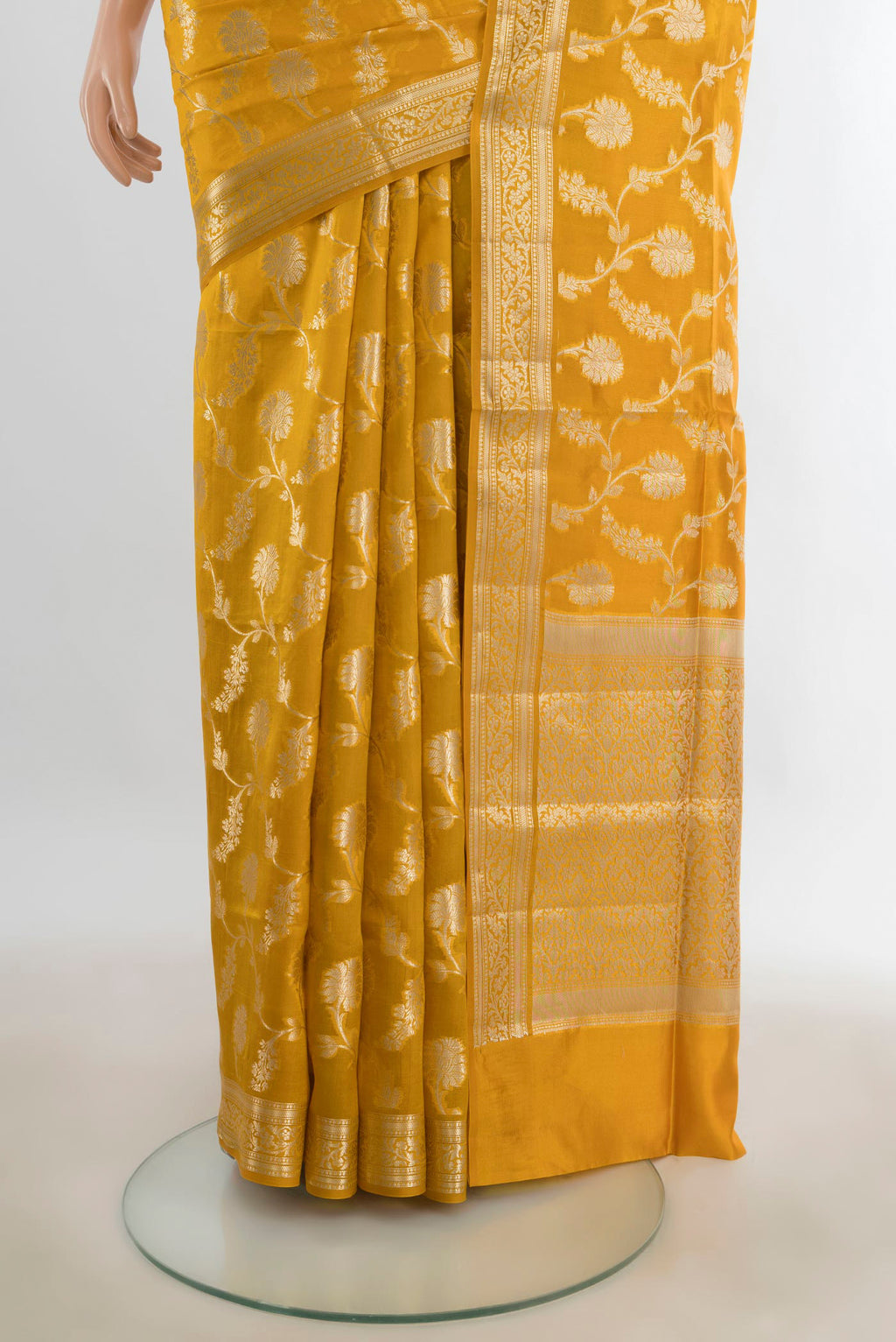 Pleats and pallu of Pure Silk Mustard Banarasi Raw Saree with Zari Butta on the body and Silk Border. 