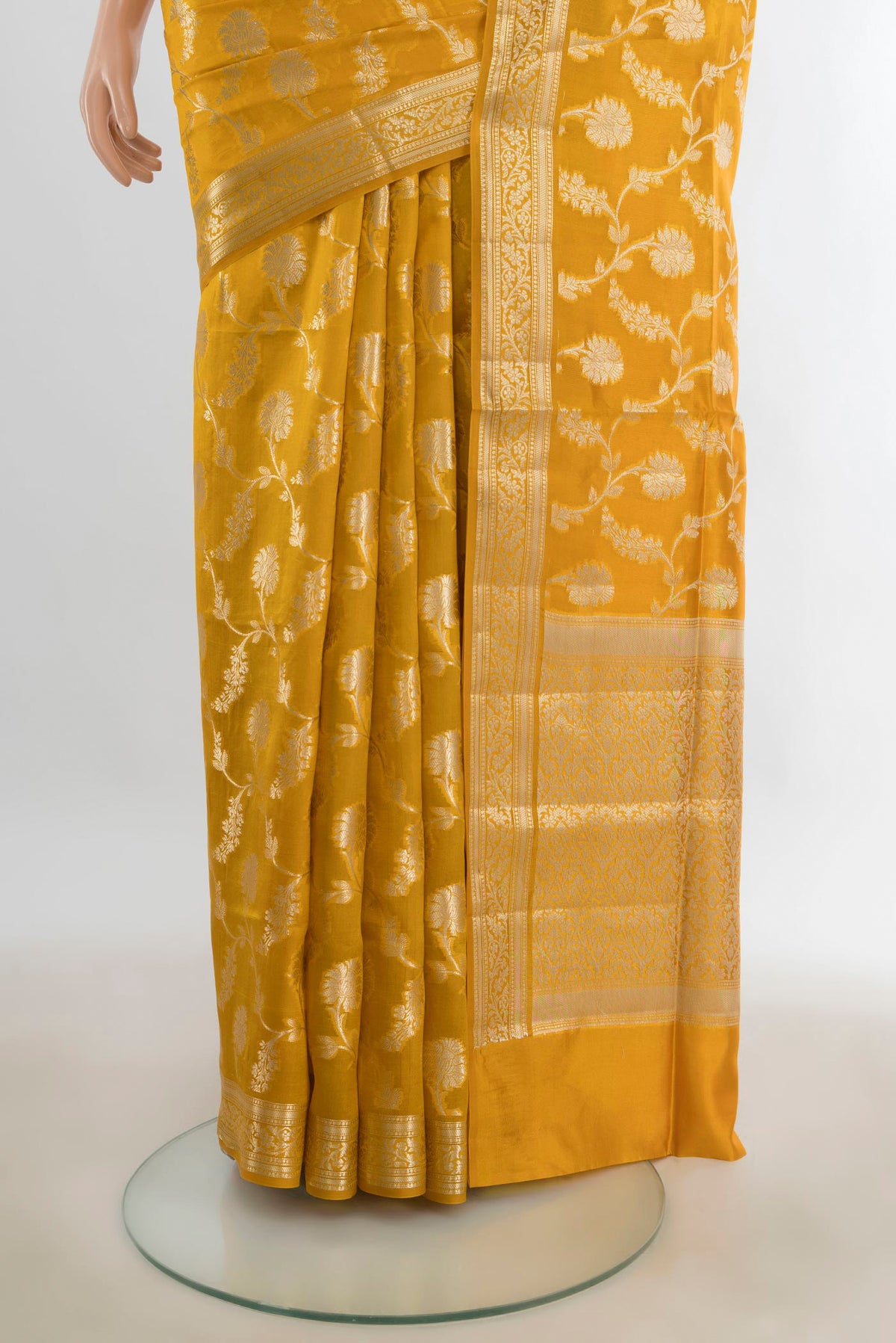 Pleats and pallu of Pure Silk Mustard Banarasi Raw Saree with Zari Butta on the body and Silk Border. 