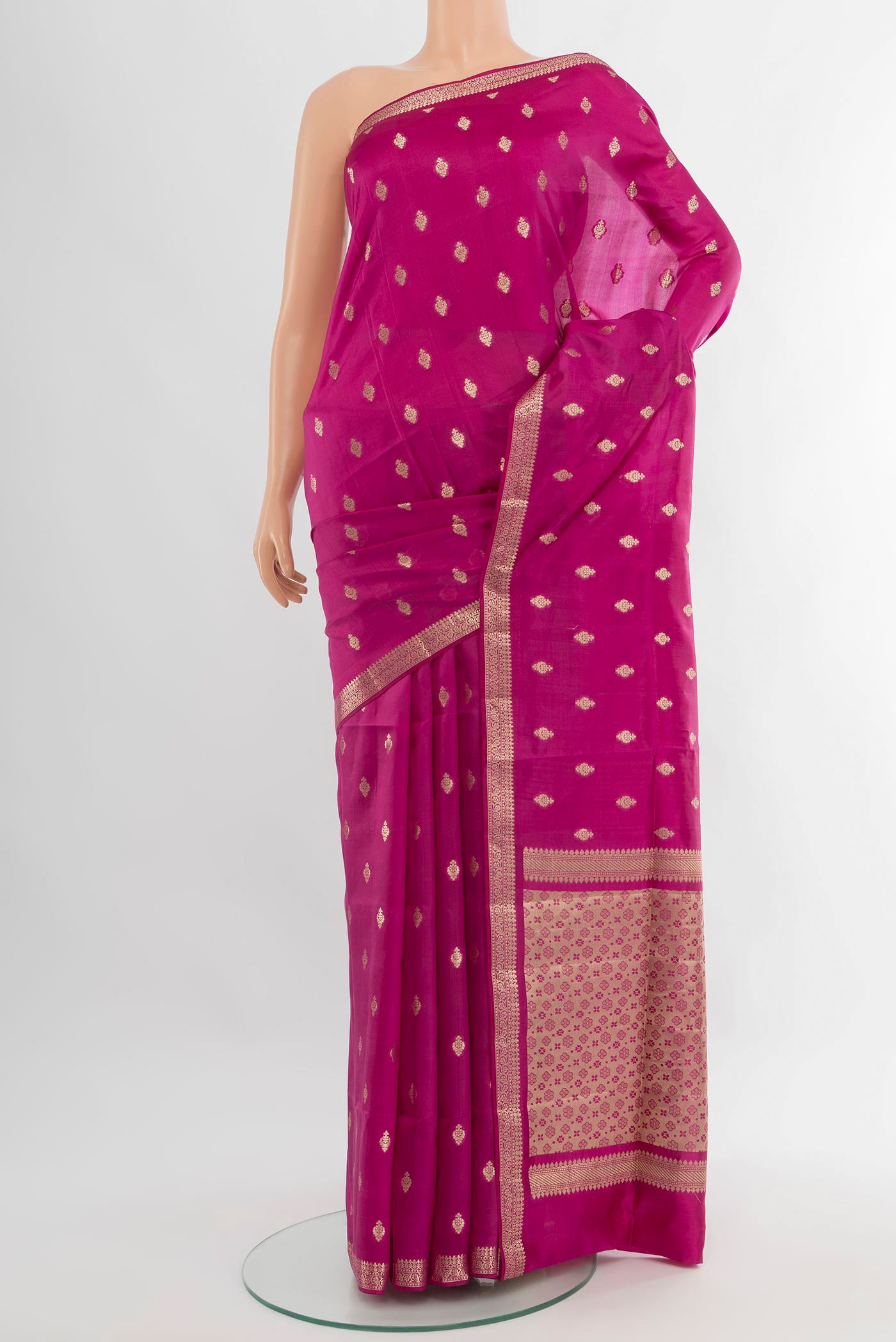 Magenta Banarasi Raw Silk Saree with Zari Butta on the body and Zari Border.  displayed on a mannequin