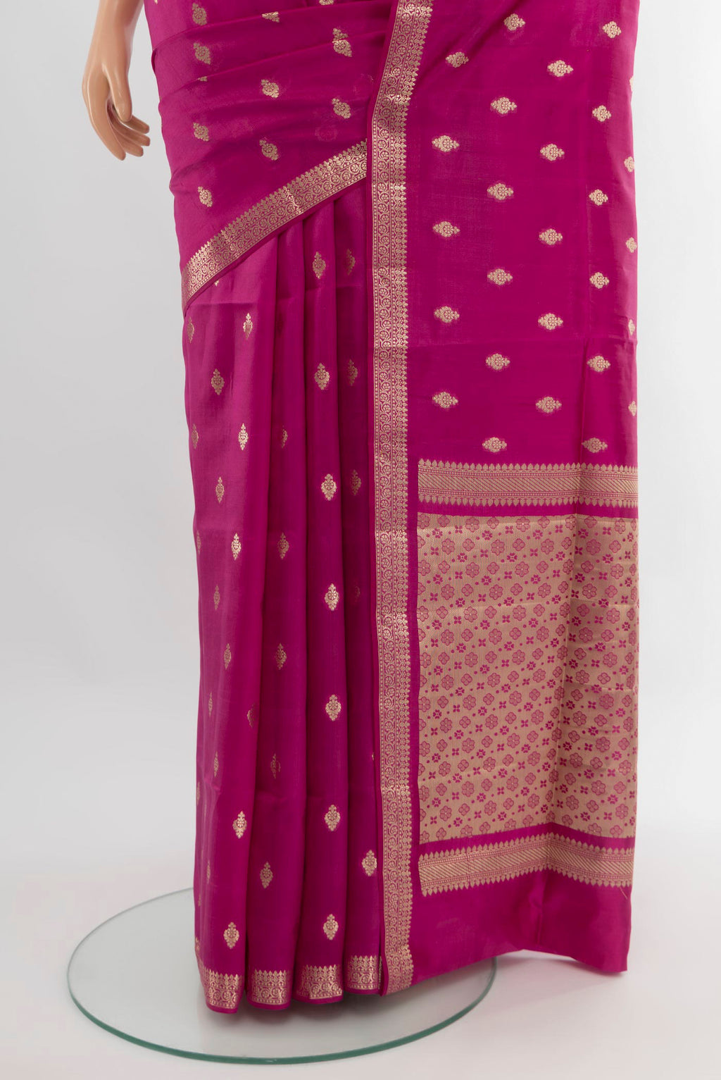 Pleats and pallu of Magenta Banarasi Raw Silk Saree with Zari Butta on the body and Zari Border. 