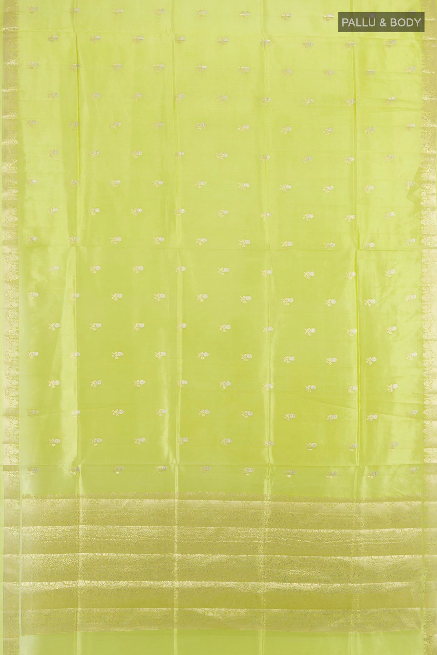 Flat view of Pista Green Banarasi Raw Silk Saree with Zari Butta on the body and Silk Border. 