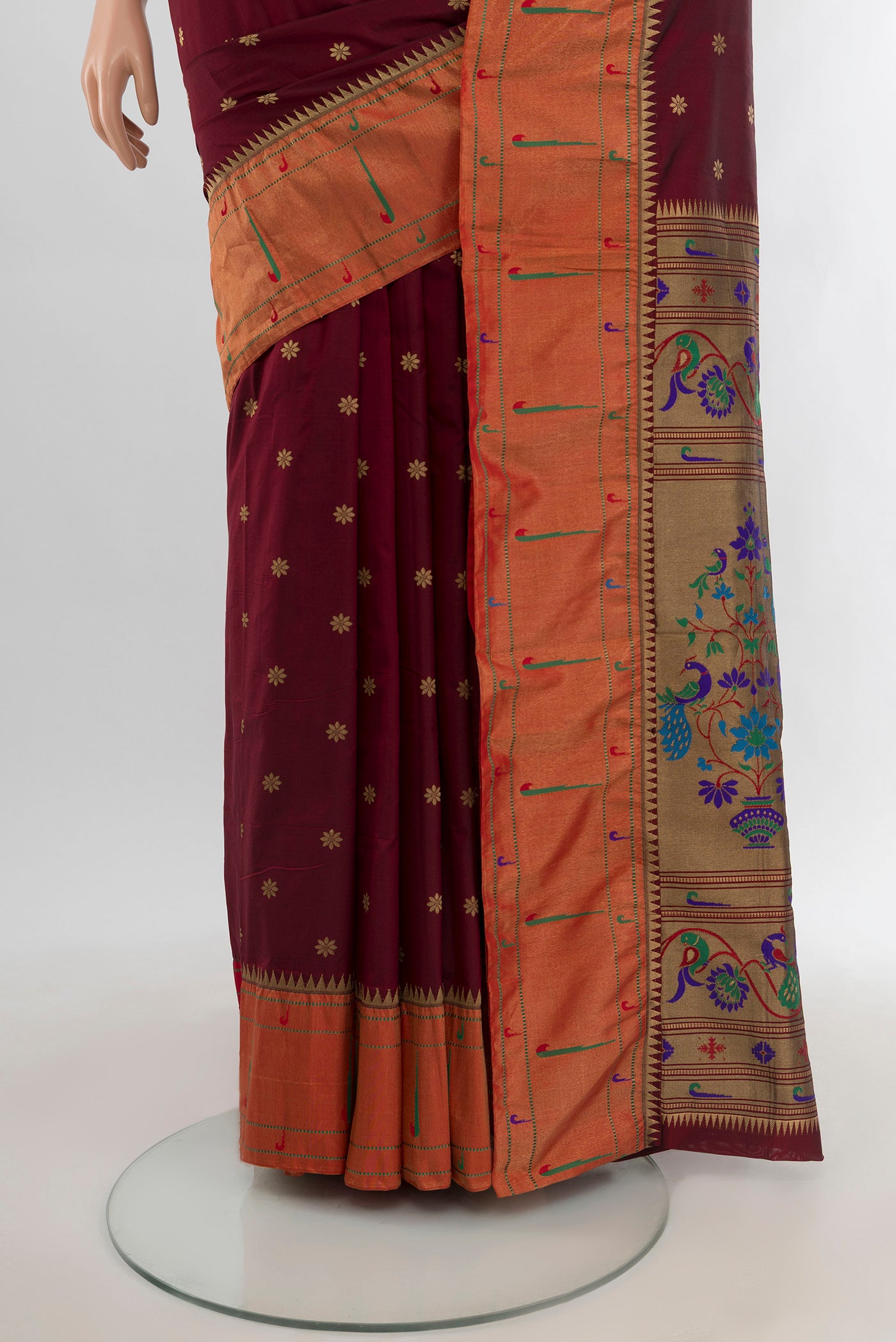 Pleats and pallu of Maroon Bangalore Silk - kadyal Saree with Zari Butta on the body and Zari Border. 