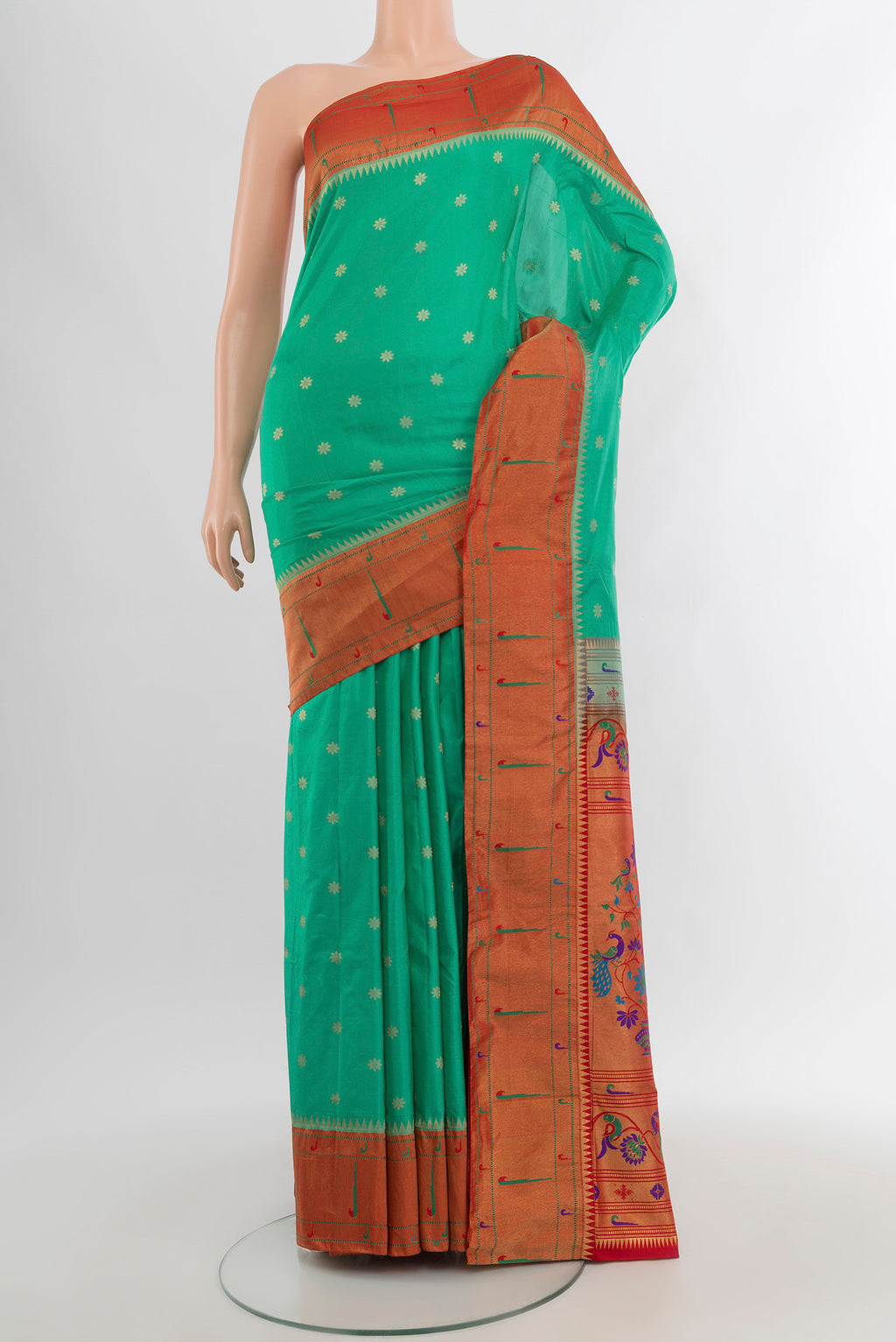 Turquoise Paithani Silk Saree with Zari Butta on the body and Paithani Border.  displayed on a mannequin