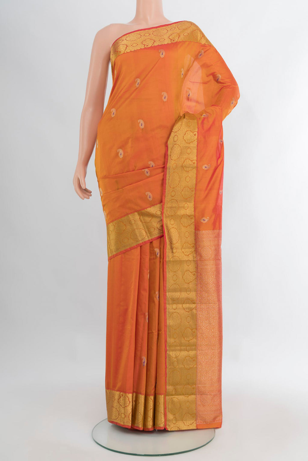Brick Orange Bangalore Silk Saree with Zari Butta on the body and Zari Border.  displayed on a mannequin
