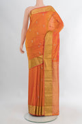 Brick Orange Bangalore Silk Saree with Zari Butta on the body and Zari Border.  displayed on a mannequin