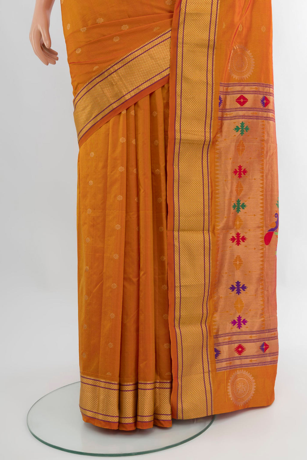 Pleats and pallu of Mustard Blended Bangalore Silk Saree with Zari Butta on the body and Zari Border. 