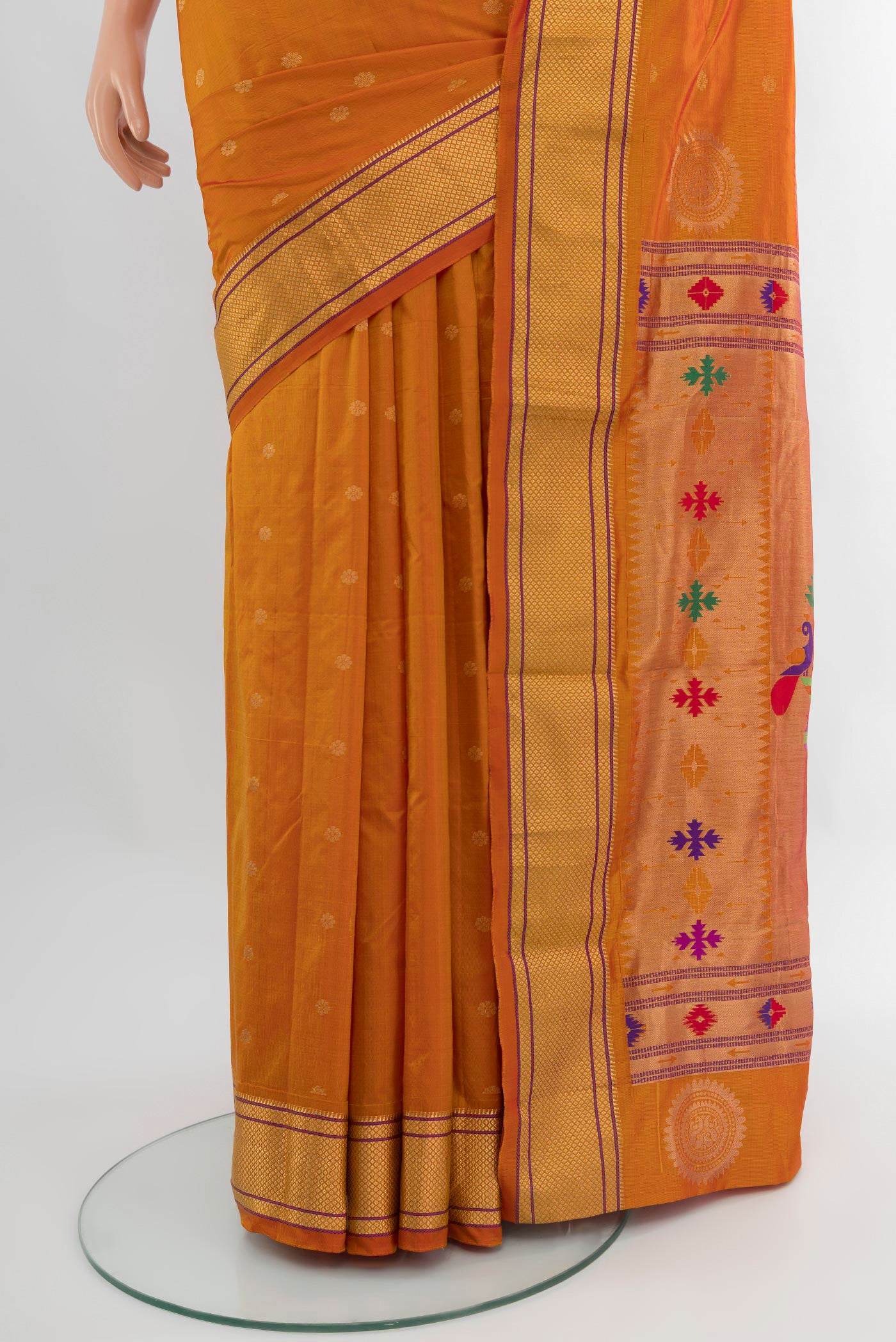 Pleats and pallu of Mustard Blended Bangalore Silk Saree with Zari Butta on the body and Zari Border. 