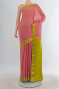 Peach Mysore Crepe Saree with Zari Butta on the body and Zari Border.  displayed on a mannequin